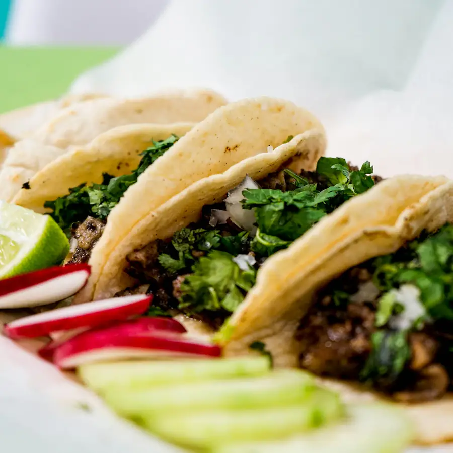 Sweet potato and black bean tacos on a family table