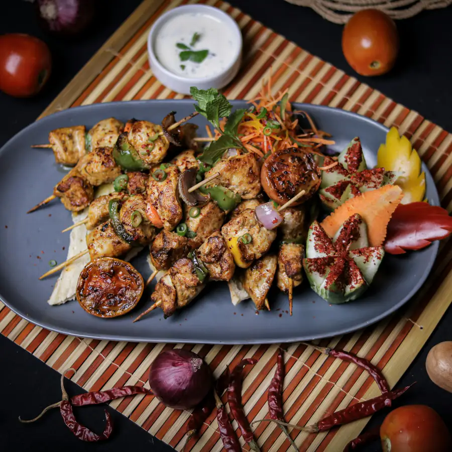 Lamb kofta with herby couscous on a plate